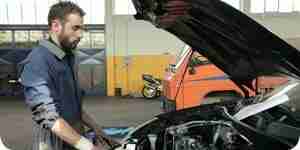 Man fixing the car's engine Man fixing the car's engine