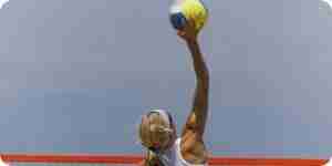 They serve a volleyball